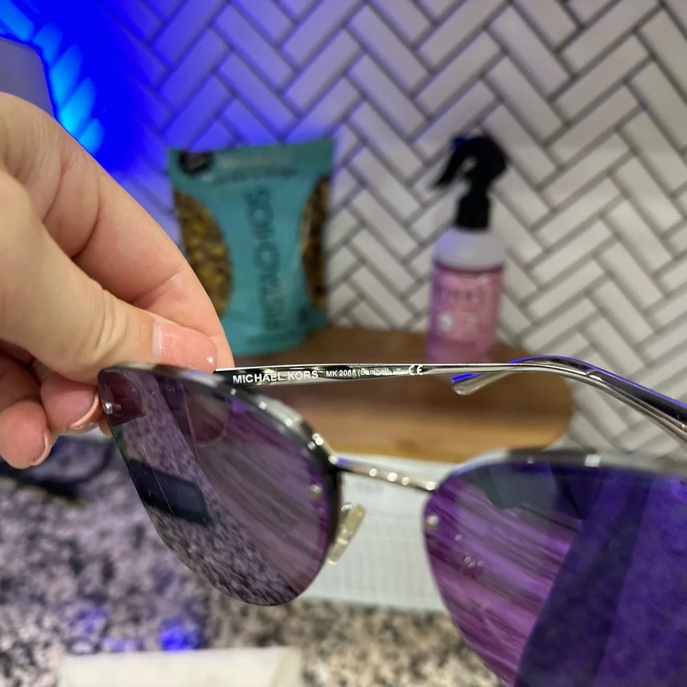 Michael Kors Sunglasses. NWOT. Never worn. Purple lenses and beautiful frame.